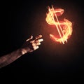 Concept of money making with dollar currency fire symbol on dark