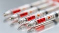 Close medium view of GLP1 medication pens aligned with a red warning hydration meter depth of field blurs background Royalty Free Stock Photo
