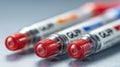 Close medium view of GLP1 medication pens aligned with a red warning hydration meter depth of field blurs background Royalty Free Stock Photo