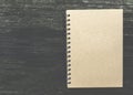 Close note book on wooden background