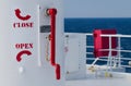 Close and open rotate red signs on deck of passenger ship Royalty Free Stock Photo