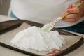 ÃÂ photo of hands of a woman who is creating with a scapula a form of a meringue