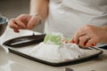 ÃÂ photo of hands of a woman who is creating with a scapula a form of a meringue