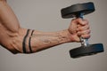 Close photo of a muscular arm which is doing bicep hummer curls Royalty Free Stock Photo