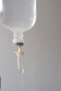 Close photos of a brine bottle hanging on a pole in a hospital on a white background