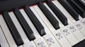 Close piano keys with note signs. Musical education. Learning of to play piano. Royalty Free Stock Photo