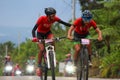 Close pictures of two cyclist keeping each other to reach the finish line