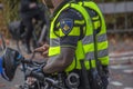 Close Of Police Men With Bicycles At Amsterdam The Netherlands 2018