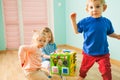 Portrait of boy and two girls playing together Royalty Free Stock Photo