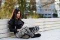 Close portrait of gorgeous dark-hair woman student using laptop computer at campus, charming female teenager studying on Royalty Free Stock Photo