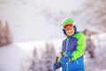 Portrait of skier boy in ski mask over mountain Royalty Free Stock Photo