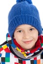 Close portrait of smiling boy in winter clothes. Cute boy in a hat with and a scarf. Isolated on white Royalty Free Stock Photo