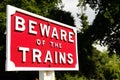 Close up of railway sign reading BEWARE OF THE TRAINS.