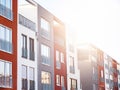 Close rows of bright sun over apartments