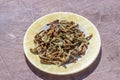 Close shoot of string beans dried under the sunlight on the plate