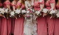 Close shot of a bride with her bridesmaids holding flowers Royalty Free Stock Photo