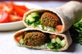 close shot of falafel inside a pita pocket