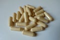 Close shot of handful of capsules of milk thistle extract