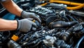 Close shot of a hands technician repairing an engine modern car Royalty Free Stock Photo