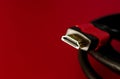 A close shot of HDMI cable on a red background Royalty Free Stock Photo