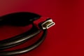 A close shot of HDMI cable on a red background Royalty Free Stock Photo