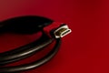 A close shot of HDMI cable on a red background Royalty Free Stock Photo