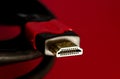 A close shot of HDMI cable on a red background Royalty Free Stock Photo