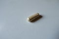 Close shot of light beige capsule of Saccharomyces boulardii probiotic