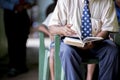 Close shot of a male flipping the pages of the book with a blurred background Royalty Free Stock Photo