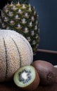 Some fruits include a big pineapple, honeydew melon and kiwis. Royalty Free Stock Photo