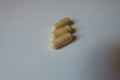 Close shot of 3 beige capsules of milk thistle extract