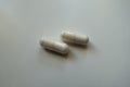 Close shot of 2 capsules of magnesium citrate