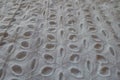 Close shot of white eyelet embroidery cotton fabric