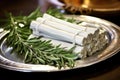close shot of white sage bundle on a silver platter Royalty Free Stock Photo