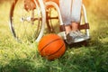 Basket ball is laying near wheelchair