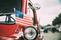 Close Side View Of Red Pickup Truck With Small American Flag Waving Royalty Free Stock Photo