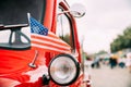 Red Pickup Truck With Small American Flag Waving. Close Side View Of Red Pickup Truck American Flag Waving. 4th of July Royalty Free Stock Photo