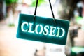 Close sign hanging on glass of shop Royalty Free Stock Photo