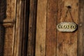 Close sign on a wooden door