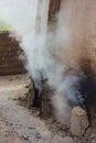 Close-smoke charcoal stove.