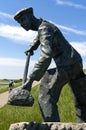 Close statue of mud worker on of the North Sea