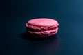 Sweet and delicate macaroon cookies on a black background