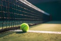 Close of tennis ball on white line near net