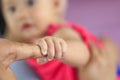 Close to the child is holding an adult hand Royalty Free Stock Photo