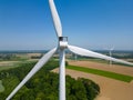 Close to the turbine. Wind turbine from aerial view - Sustainable development, environment friendly. Wind mills during