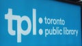 close on toronto public library outdoor sign, shot on angle, white writing tpl