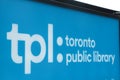close on toronto public library outdoor sign, shot on angle, white writing tpl