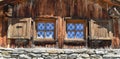 two little window on a facade of a mountain chalet
