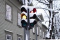 Traffic light under during snow storm