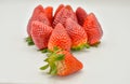 Close uo view of a group of several tasty fresh red strawberries just harvested and ready to be eaten. The strawberries are put Royalty Free Stock Photo